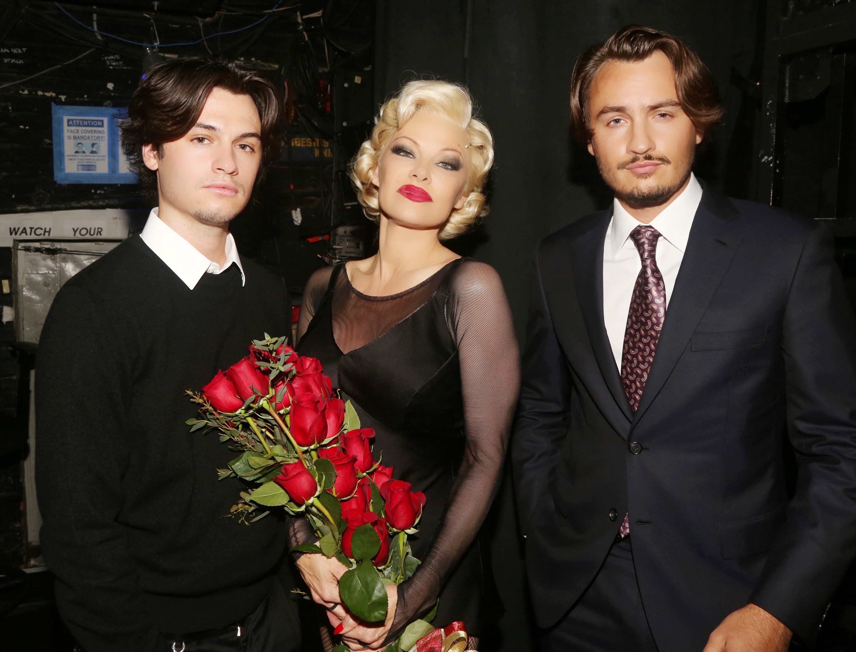 Dylan Lee, Pamela Anderson and Brandon Lee during the opening night of her Broadway debut as Roxie Hart in the musical "Chicago" on Broadway at the Ambassador Theatre in New York City on April 12, 2022. | Source: Getty Images