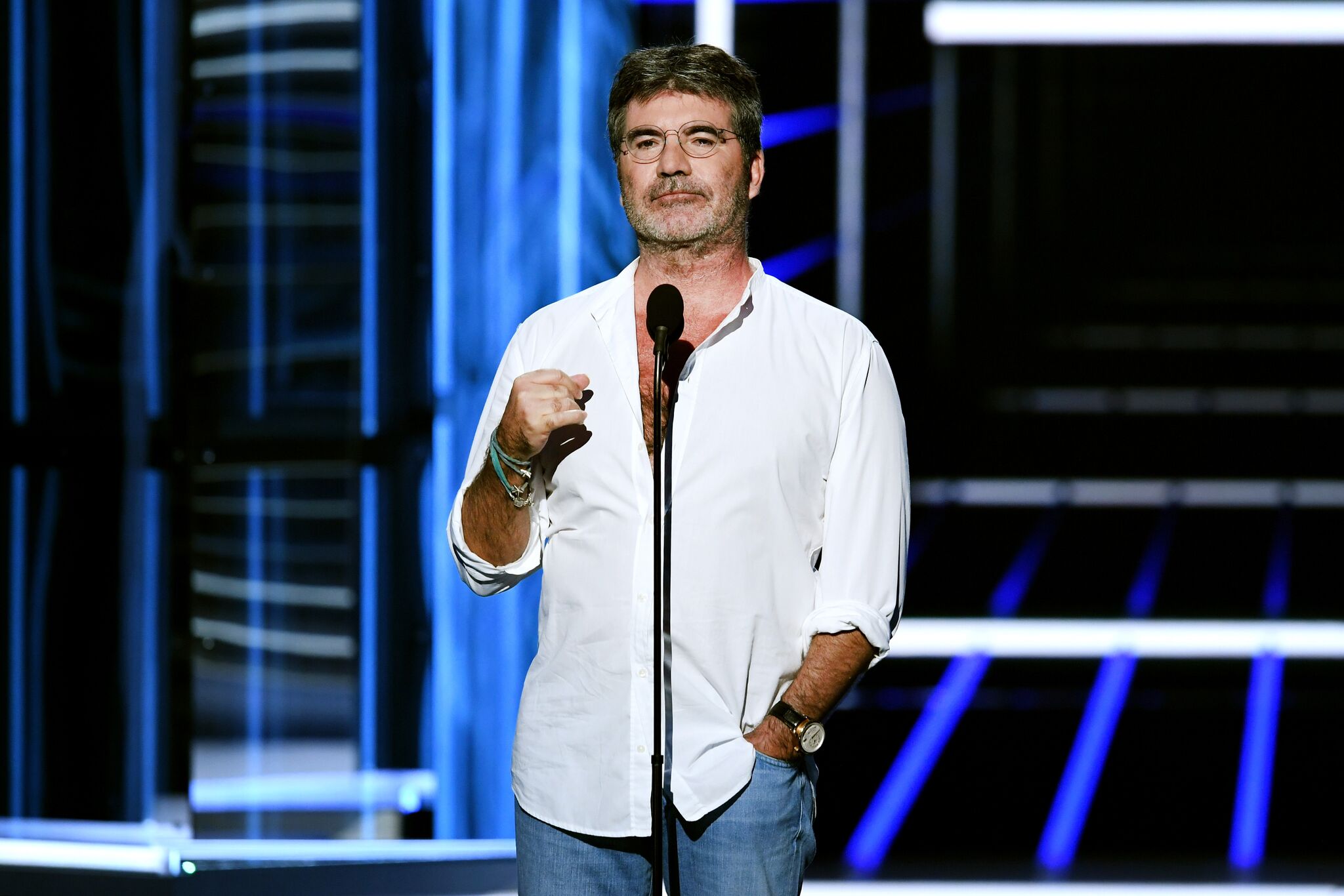 Simon Cowell speaks onstage during the 2018 Billboard Music Awards | Getty Images