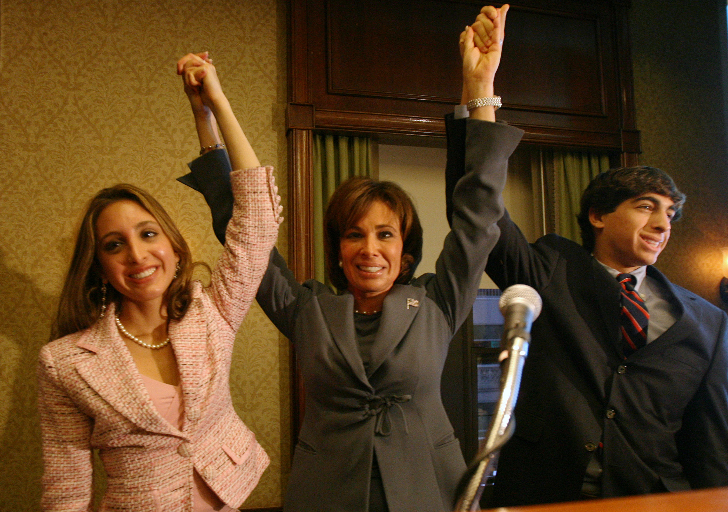 Jeanine Pirro,  center, with her daughter Cristine, 21, left, and her son Alex, 17, right, at a fundraiser for her campaign, Tuesday, October 3, 2006, in New York. | Source: Getty Images