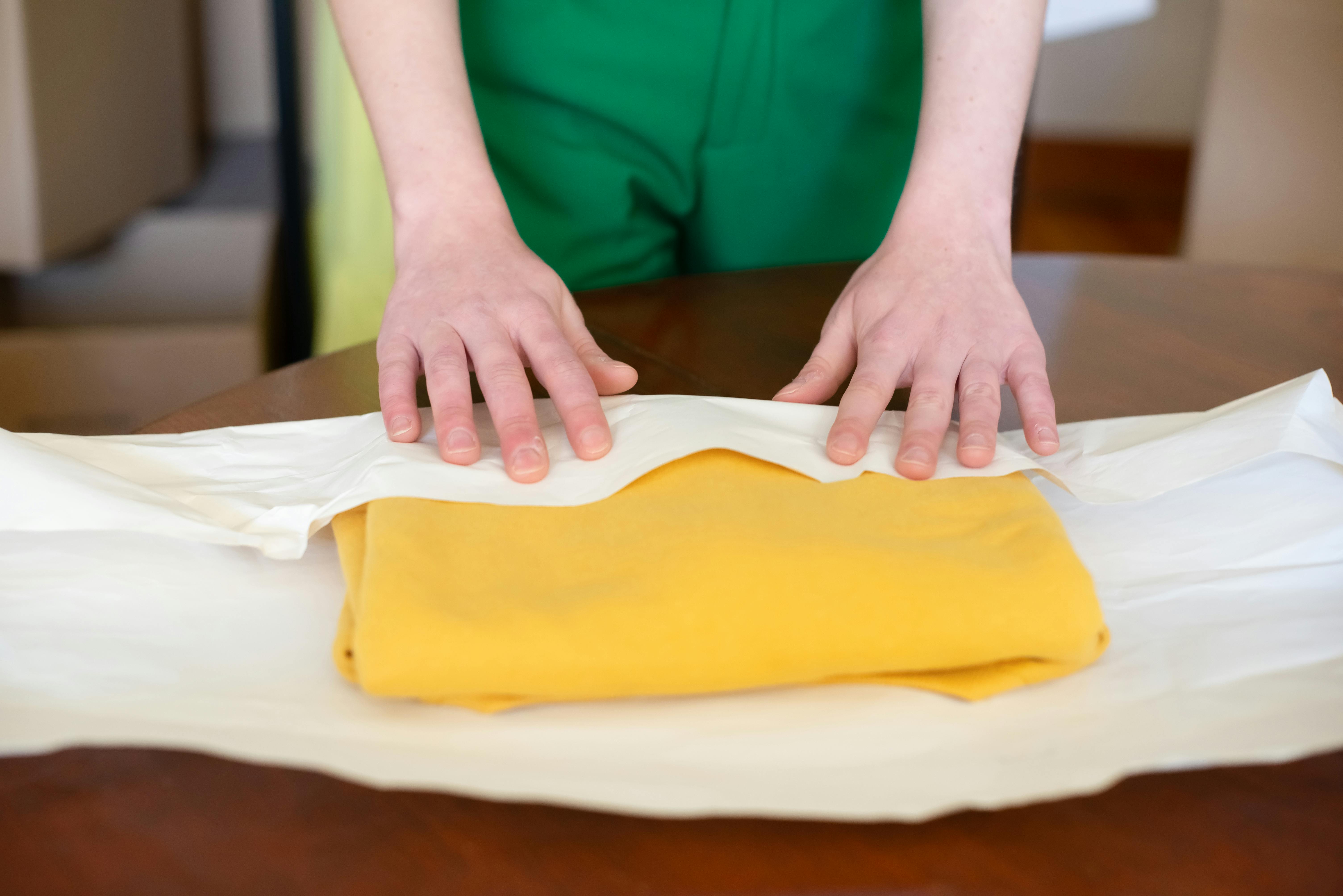 A gift being wrapped in cloth | Source: Pexels