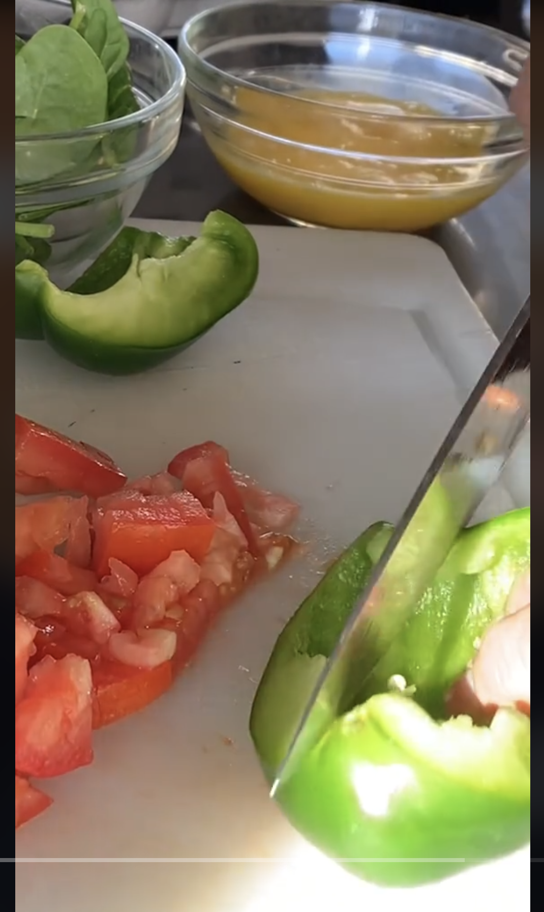 A person chopping vegetables on a cutting board, as seen in a video dated September 22, 2023 | Source: TikTok/@consumerreports