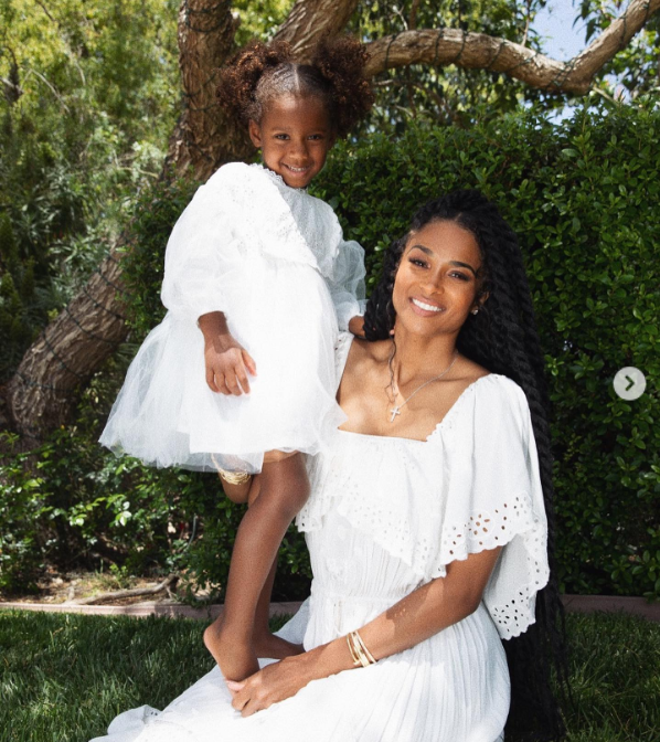 Ciara and her daughter, Sienna Wilson, posing in white dresses outdoors on May 22, 2021 | Source: Instagram/ciara