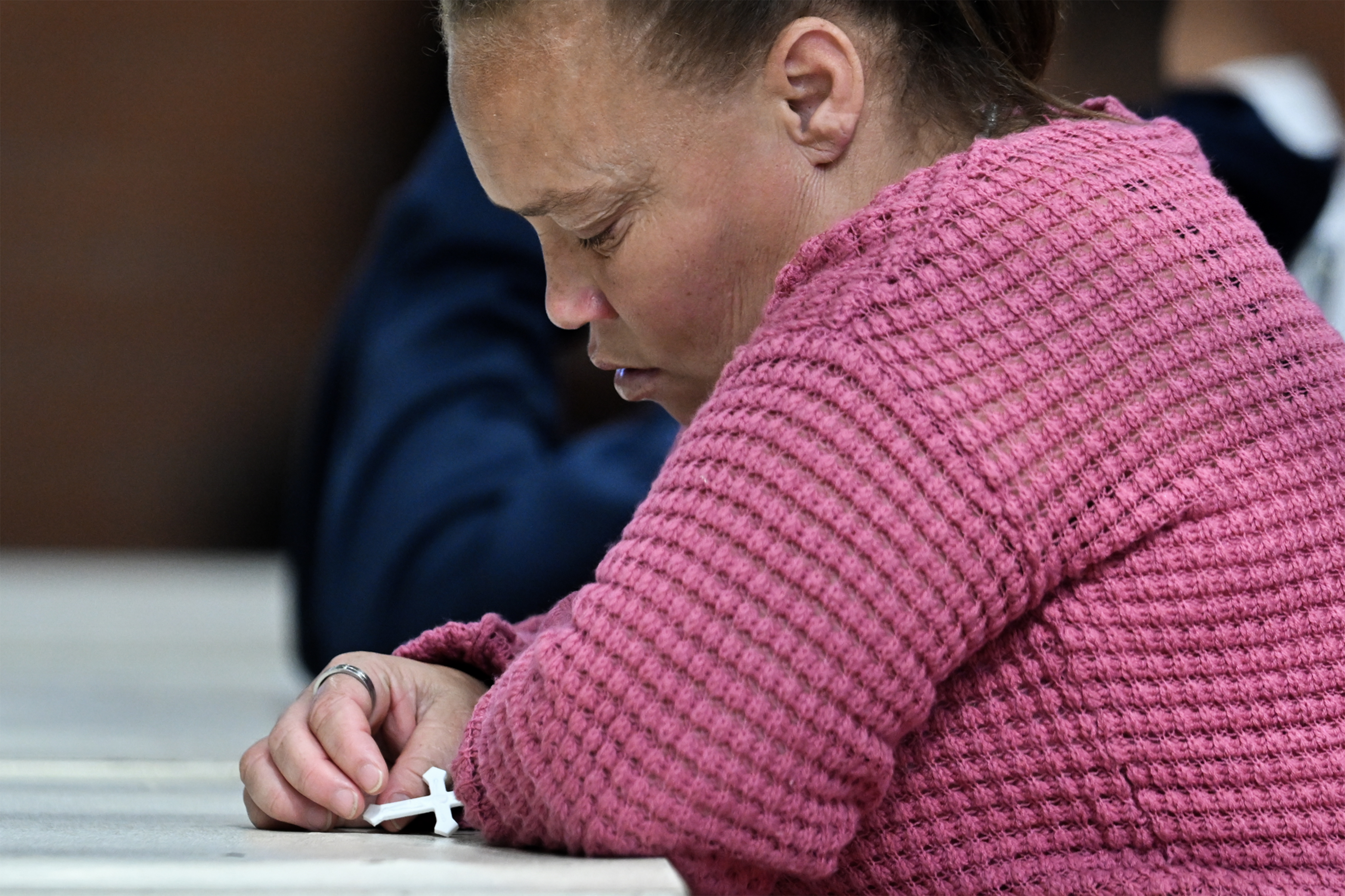 Racquel Smith is seen holding a cross during the trial in the Joshlin Smith disappearance case on Day 7 at the White City Multipurpose Centre on March 11, 2025, in Saldanha Bay, South Africa | Source: Getty Images