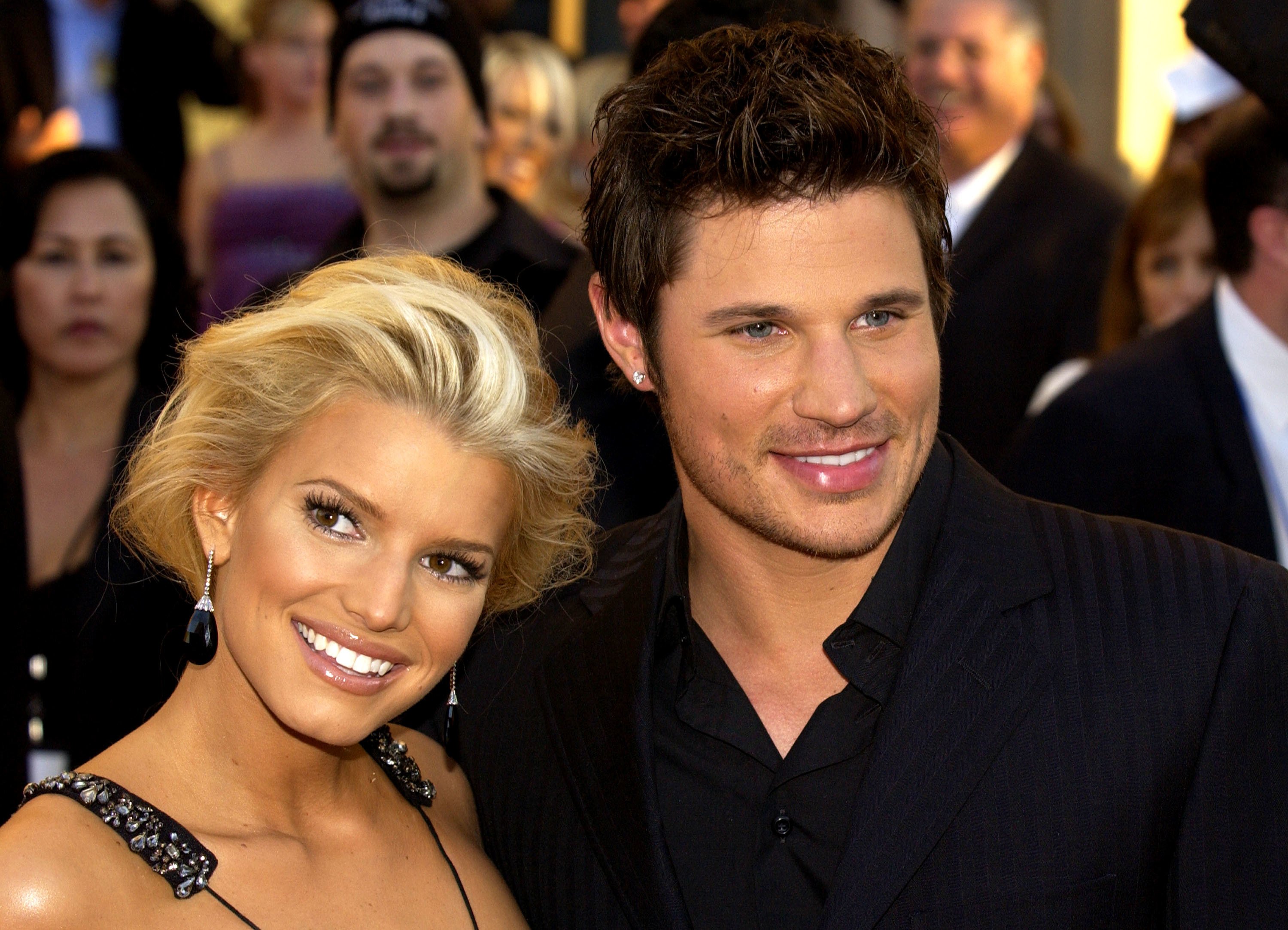 Jessica Simpson (left) and husband Nick Lachey arrive at the 32nd Annual "American Music Awards" at the Shrine Auditorium, in Los Angeles, California. | Photo: Getty Images