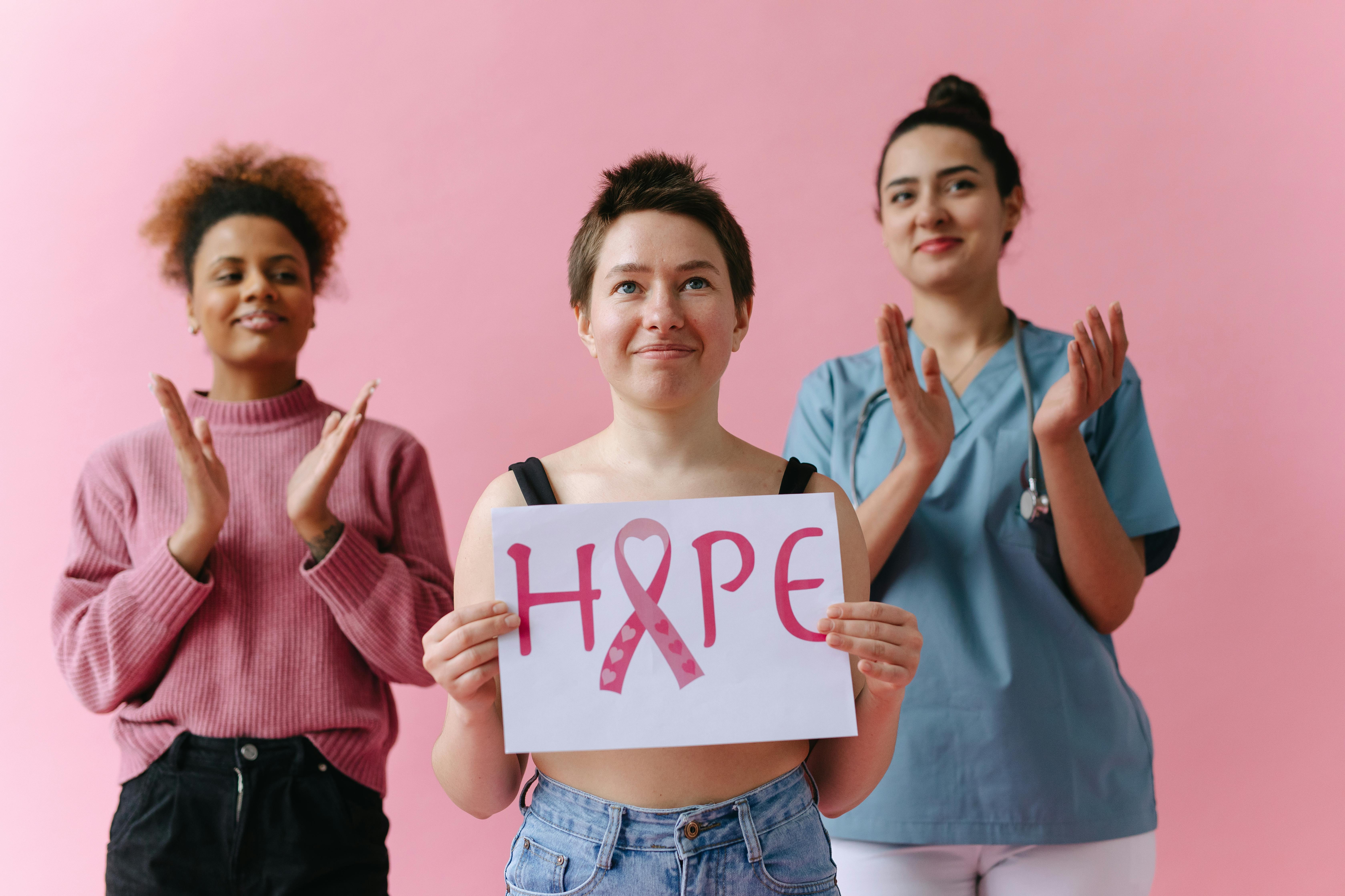 A group of women, one holding up a placard | Source: Pexels