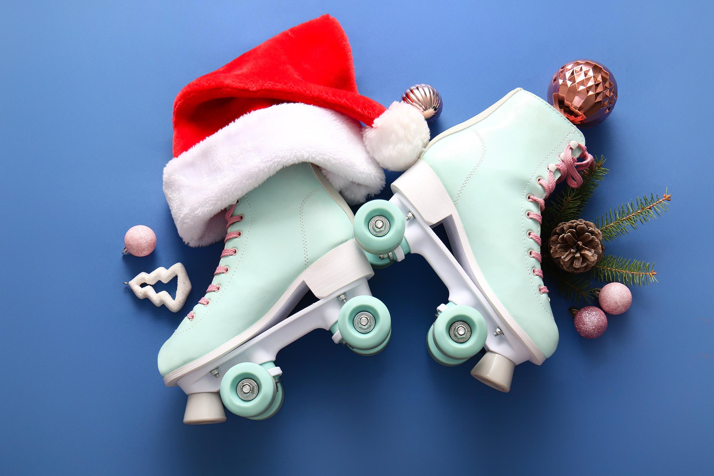 A pair of roller skates adorned with Christmas decor | Source: Shutterstock