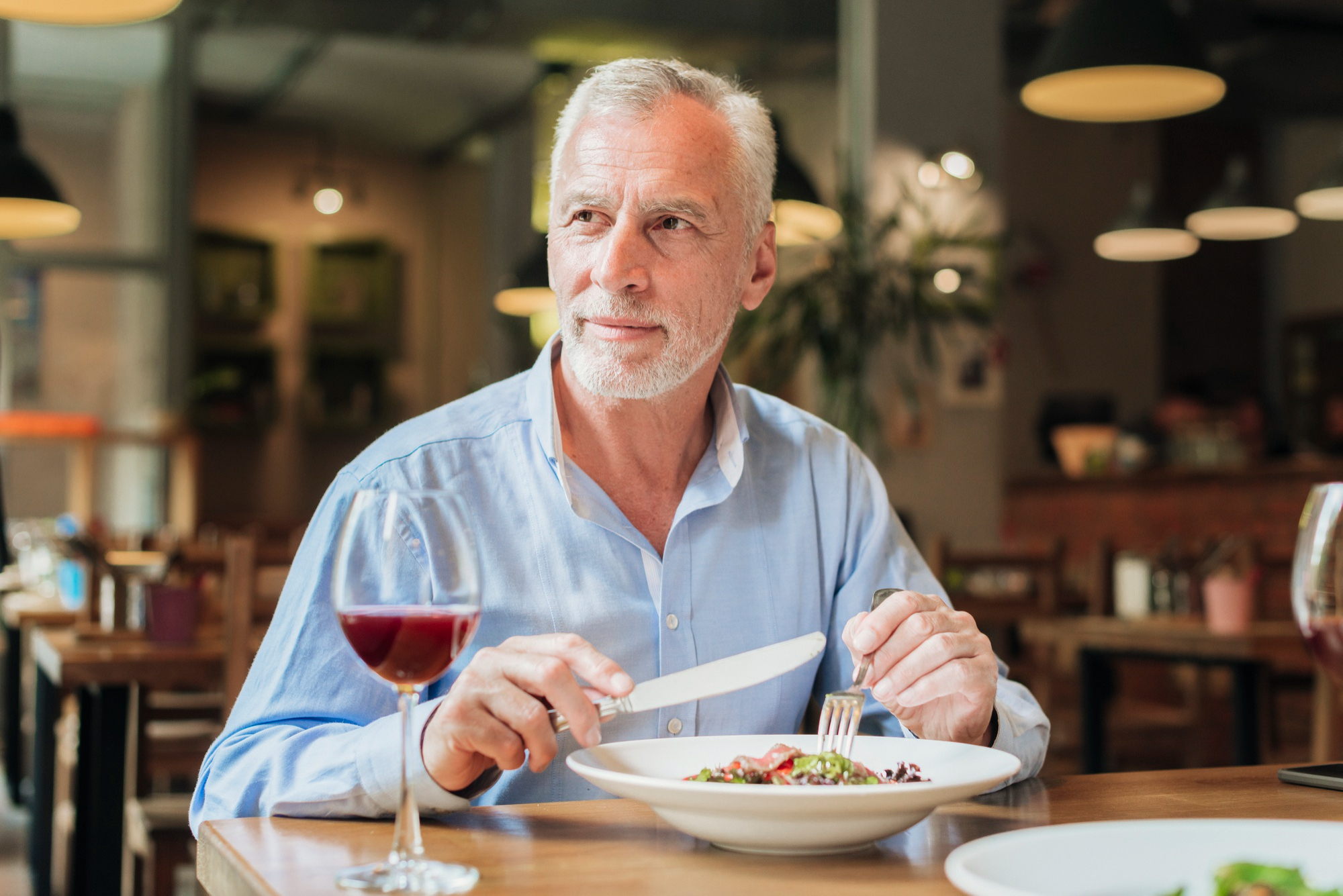 A man having a meal at a restaurant | Source: Freepik