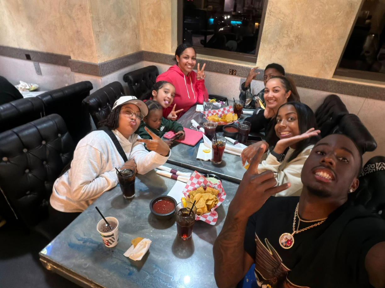 Ashley Foster’s tribute featured a warm moment of William Davis smiling alongside family and friends at a restaurant gathering. | Source: Facebook/Ashley Foster