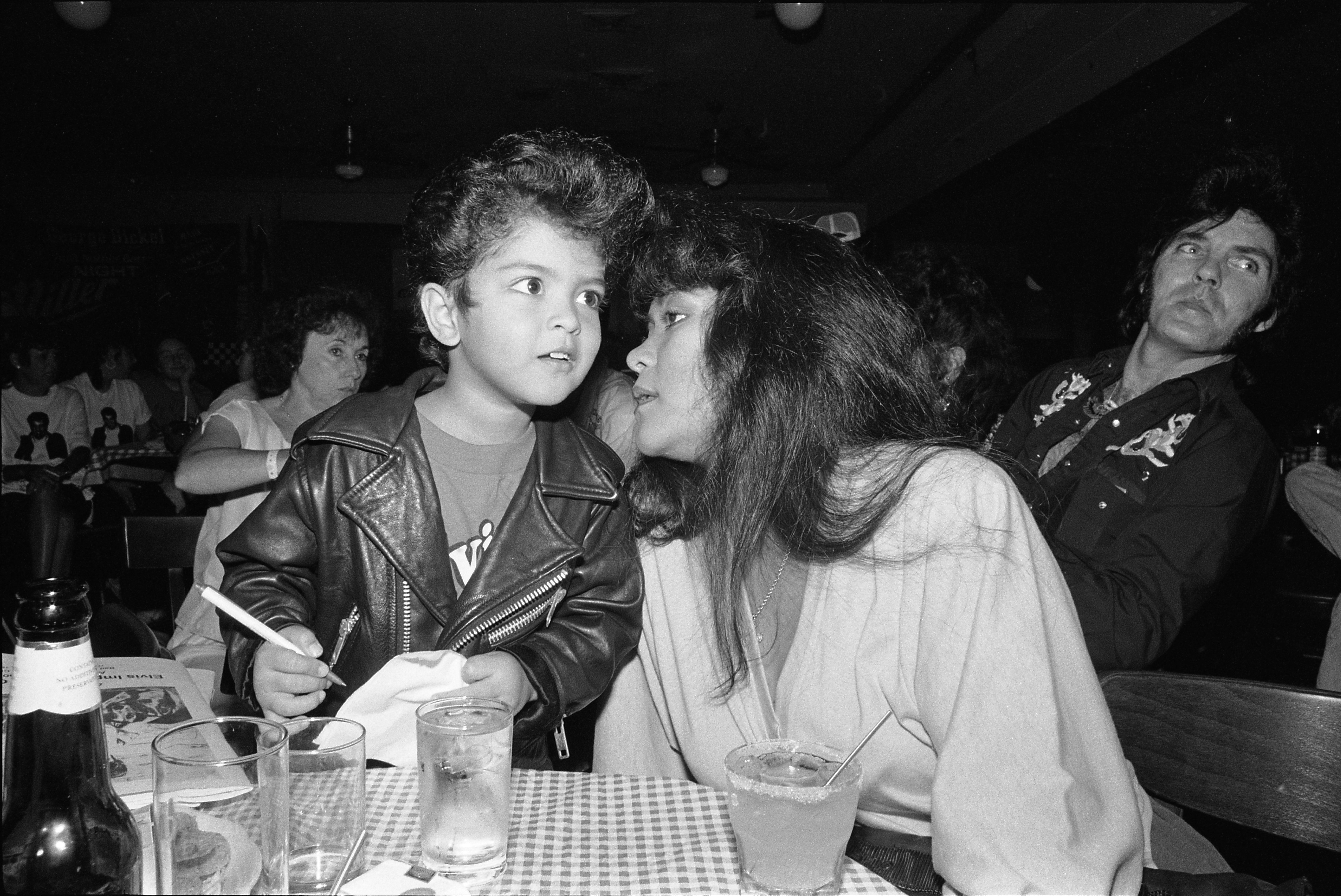 Music producer Bruno Mars pictured as a four year old Elvis Presley impersonator, with his mother in August 1990 in Memphis, Tennessee. / Source: Getty Images