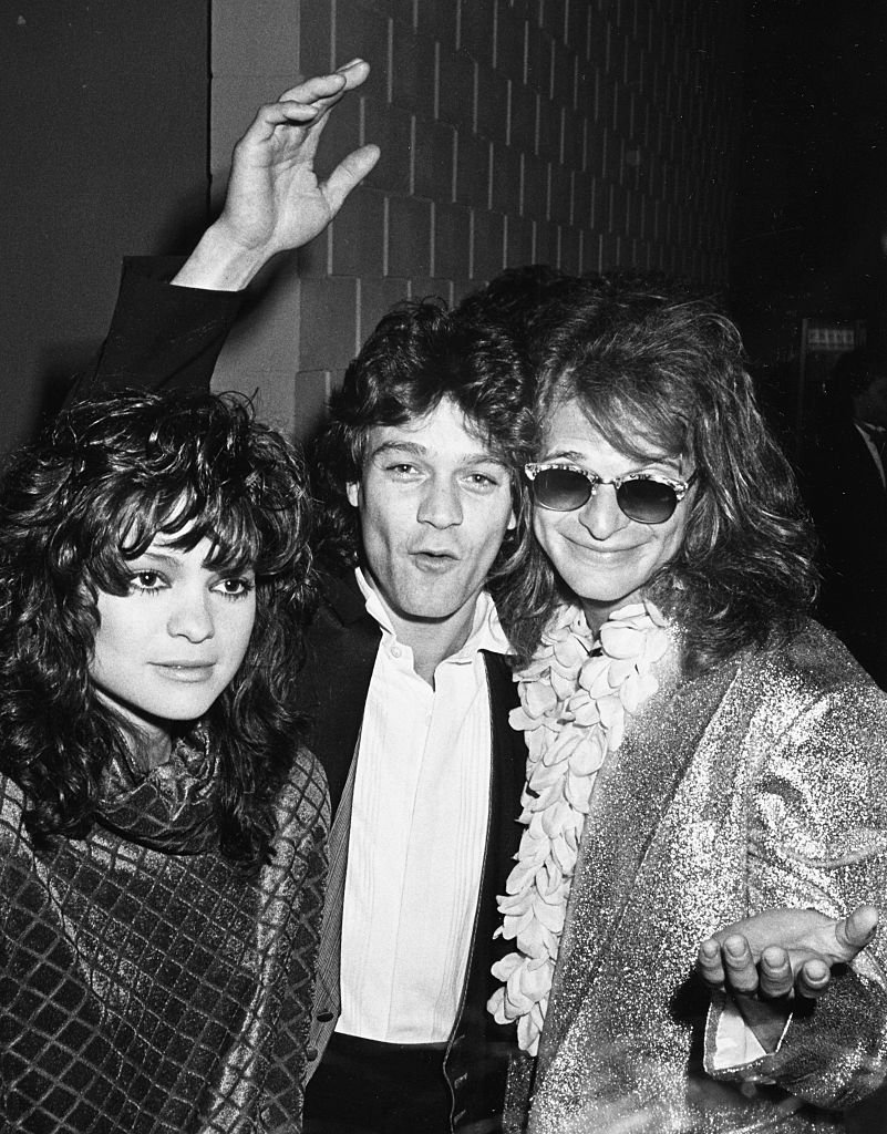 'Van Halen' musicians Eddie Van Halen (centre) and David Lee Roth, with actress Valerie Bertinelli at the Santa Monica Civic Center in California, April 3rd 1985 | Source: Getty Images
