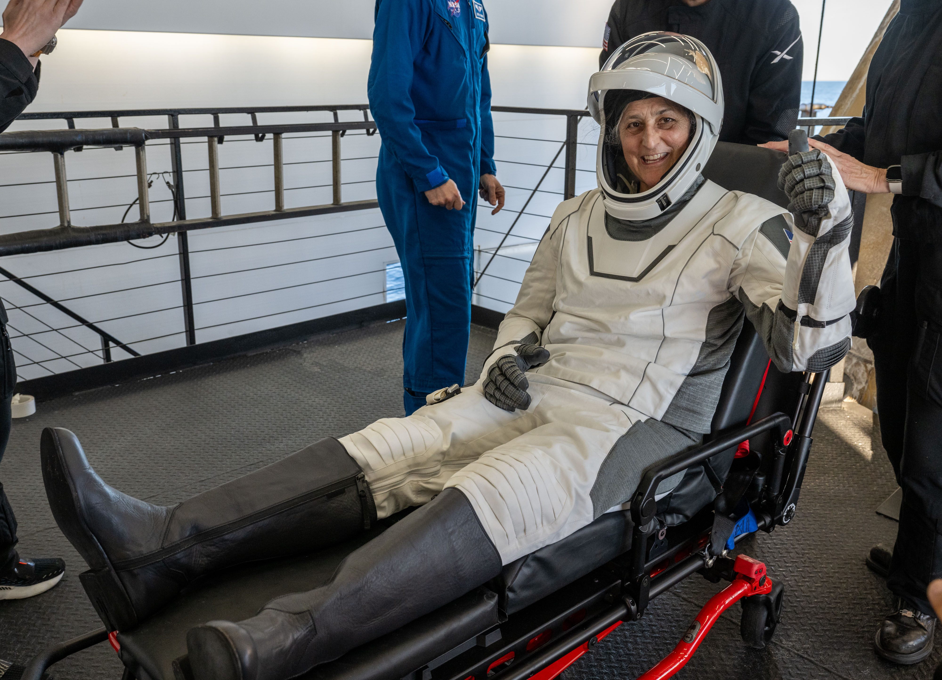 Suni Williams gives a thumbs up while being helped out of the SpaceX Dragon spacecraft | Source: Getty Images