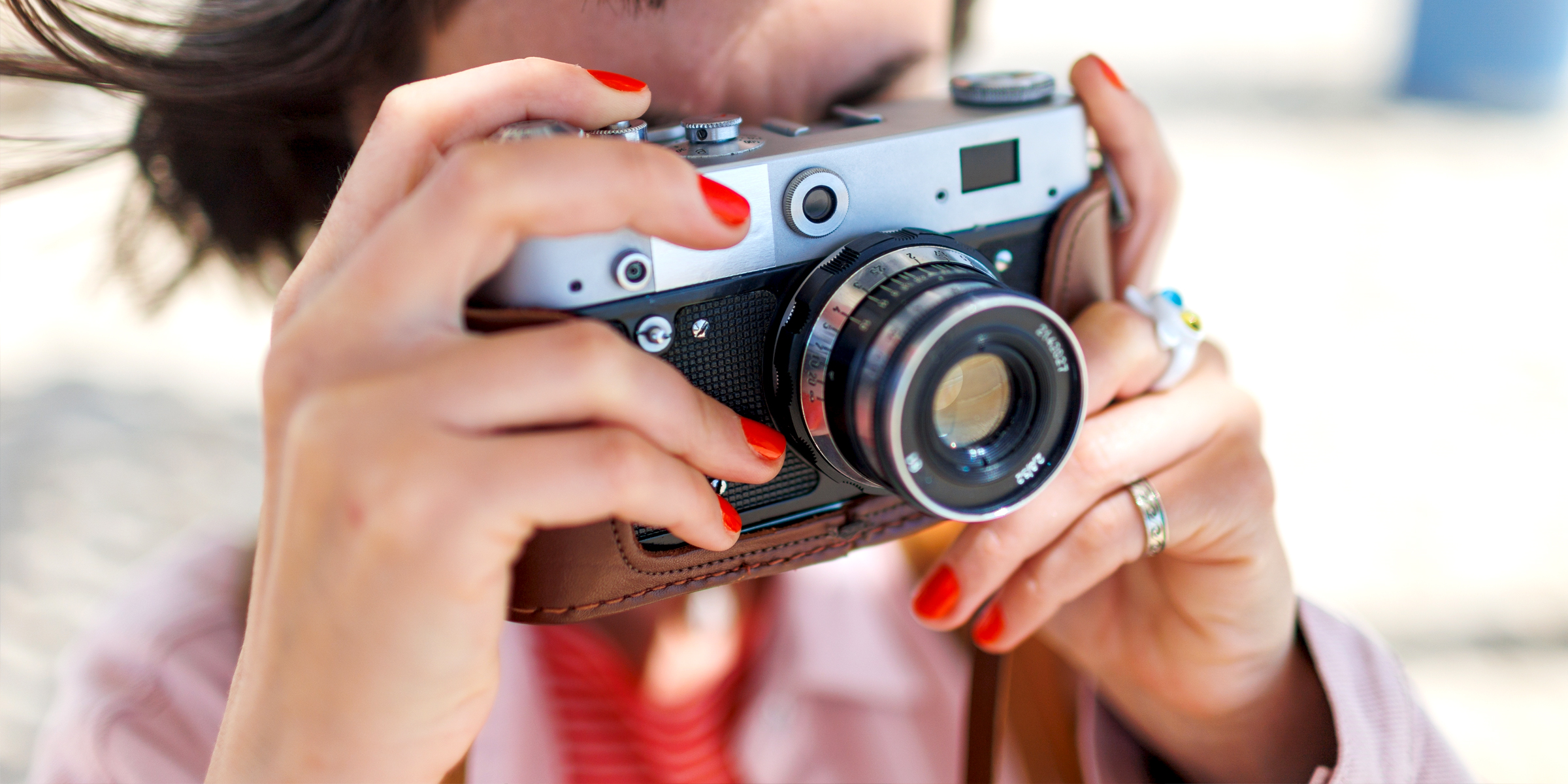 Woman taking a picture | Source: Shutterstock