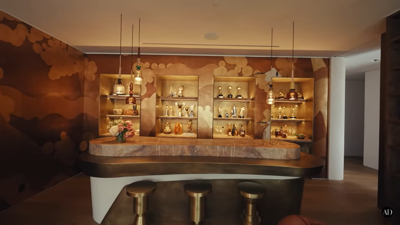 Chrissy Teigen and John Legend's awards display at their Beverly Hills home | Source: YouTube/ArchitecturalDigest