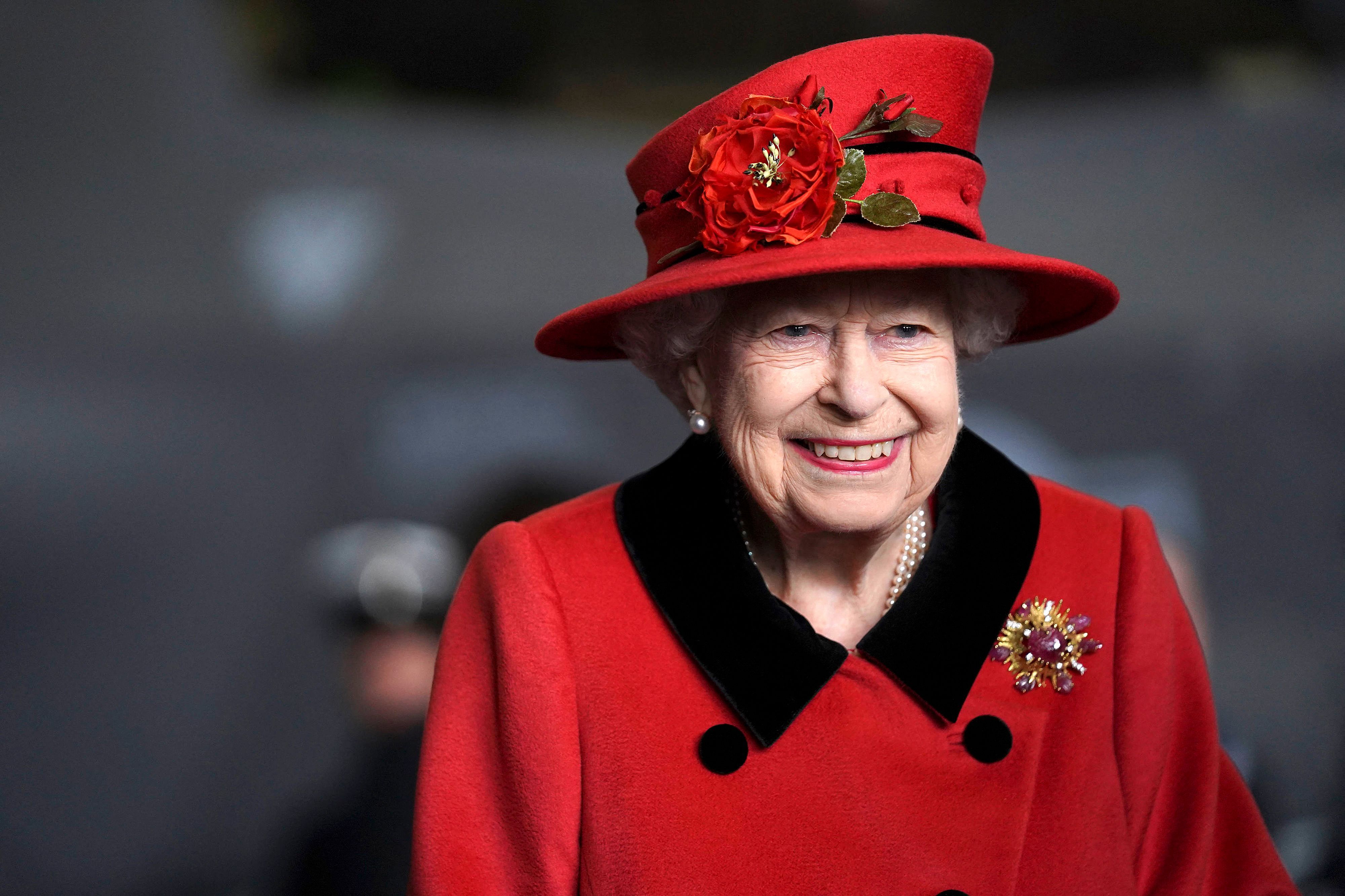 Queen Elizabeth II reacts during her visit to the aircraft carrier HMS Queen Elizabeth in Portsmouth, southern England on May 22, 2021 | Getty Images