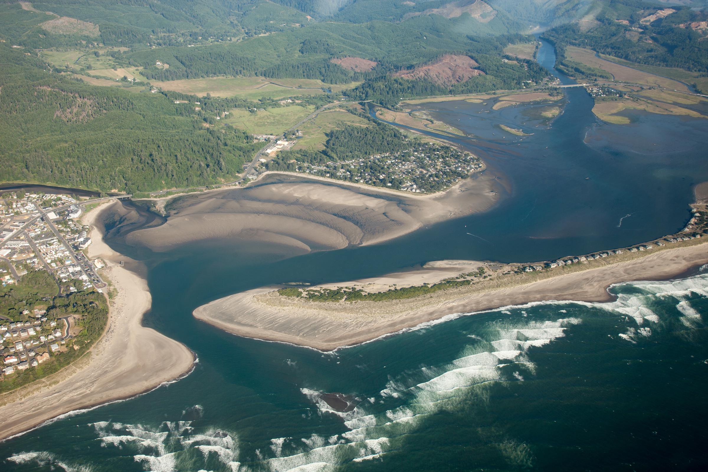 Aerial view of bedforms and dunes at Siletz Bay estuary, Oregon, with Siletz River in the background on July 23, 2010 | Source: Getty Images