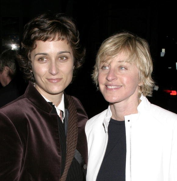 Ellen DeGeneres (R) and Alexandra Hedison attend the Opening Night Performance of "Afterbirth: Kathy and Mo's Greatest Hits", February 27, 2004, at Canon Theater in Beverly Hills, California. | Source: Getty Images.
