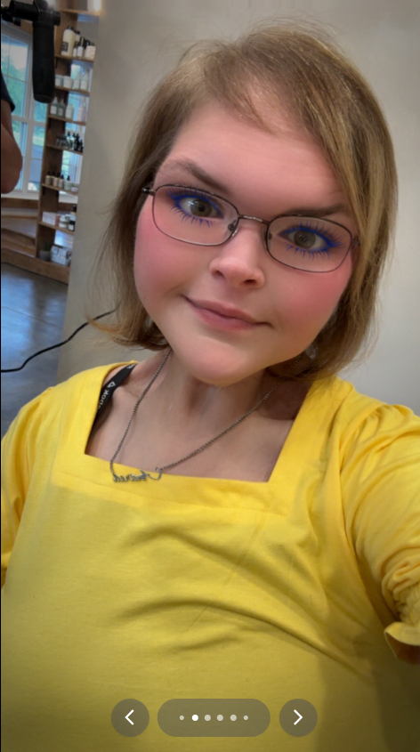 Tammy Slaton takes a selfie with a smile while in a yellow blouse and glasses, from a video post dated July 21, 2025 | Source: TikTok/tammy.l.slaton