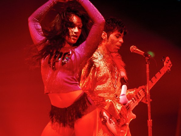  Prince and Mayte Garcia performing on stage at Wembley Arena in London, circa March 1995 | Photo: Getty Images