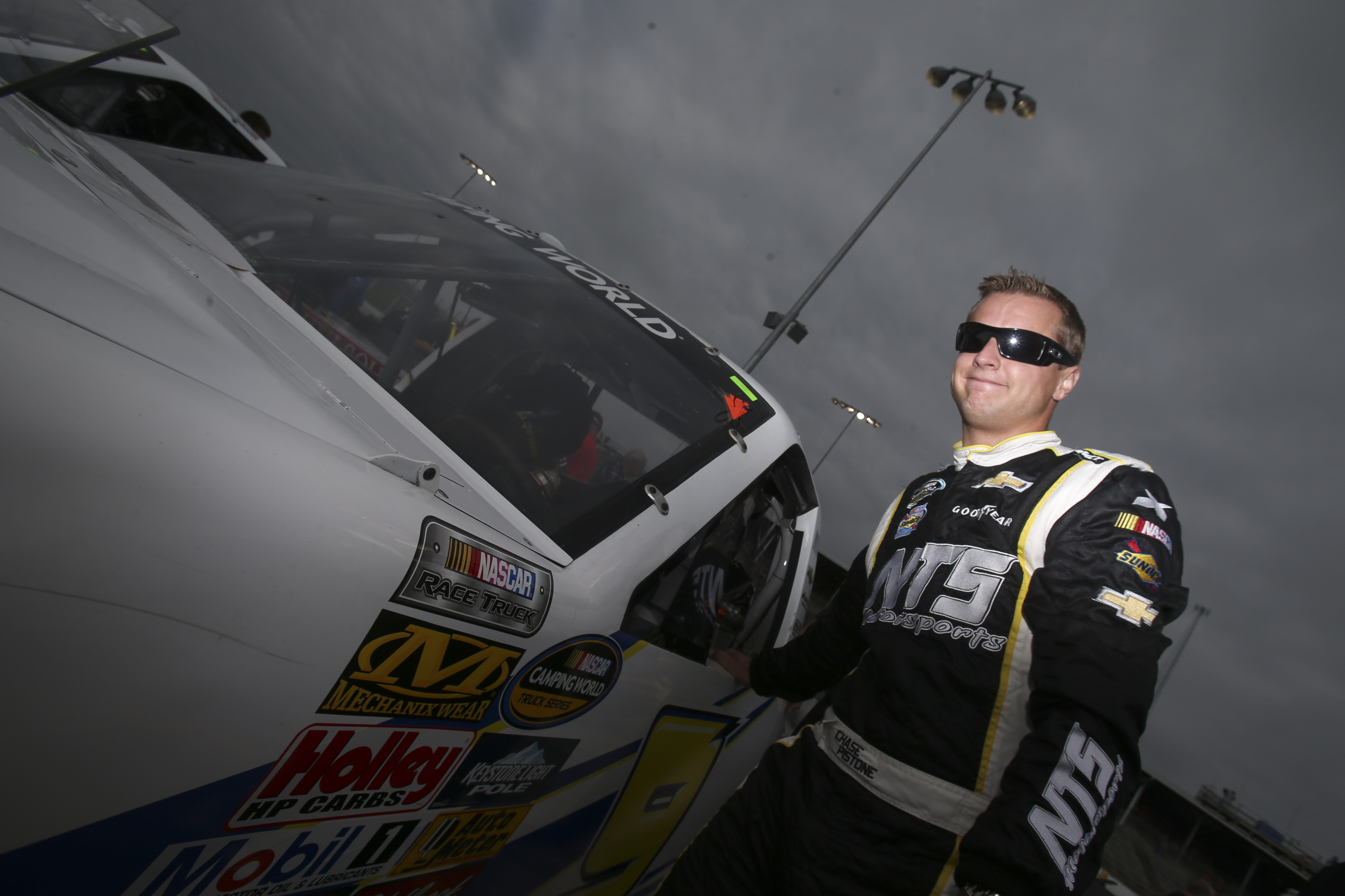 Chase Pistone stands beside his truck during practice at Eldora Speedway in Rossburg, Ohio, on July 24, 2013 | Source: Getty Images