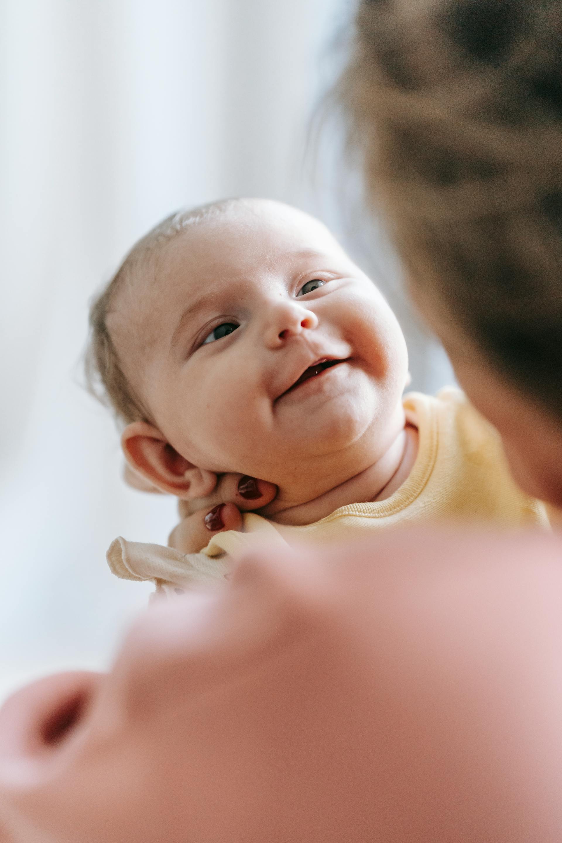 A woman holding her baby | Source: Pexels