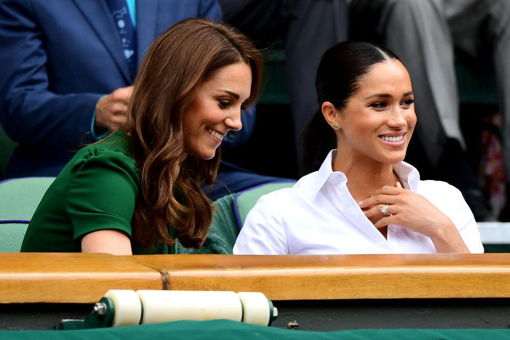 Kate Middleton and Meghan Markle at  the Royal Box during Day twelve of The Championships - Wimbledon, July 2019 | Source: Getty Images