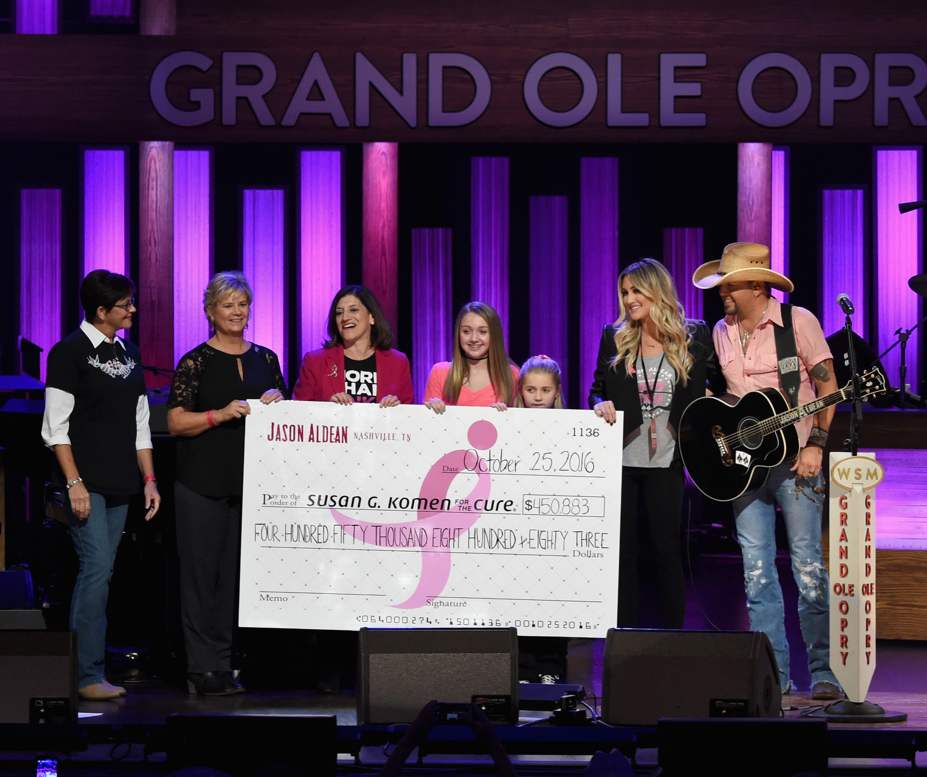 Pam Martin, Patty Harman, Susan G. Komen, Dr. Judy Salerno, Aldean's daughters Keeley and Kendyl, Brittany Aldean, and Jason Aldean at "CONCERT FOR THE CURE" on October 25, 2016, in Nashville, Tennessee. | Source: Getty Images