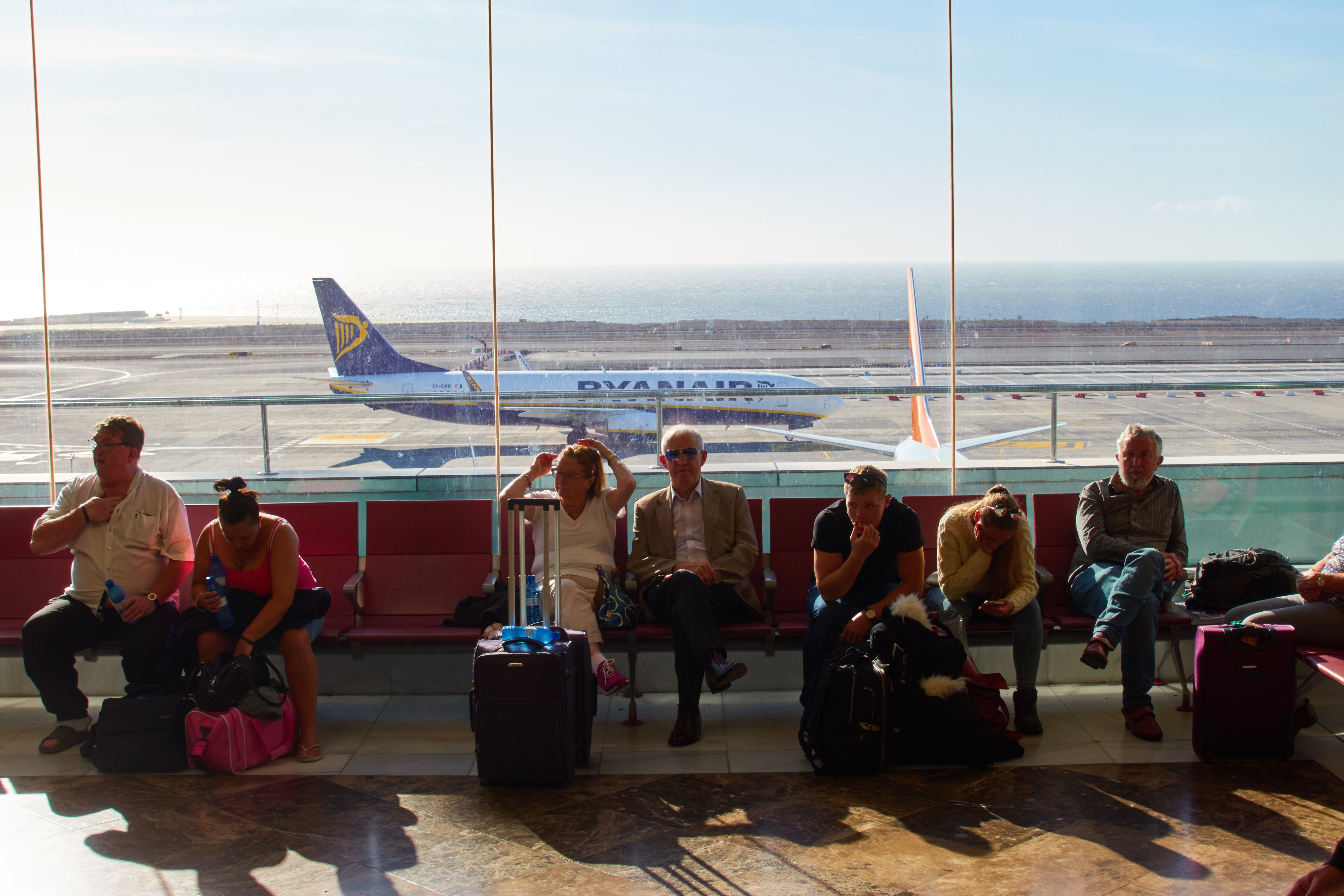 Tourists at the Reina Sofia Airport Tenerife, in Spain | Photo: Getty Images