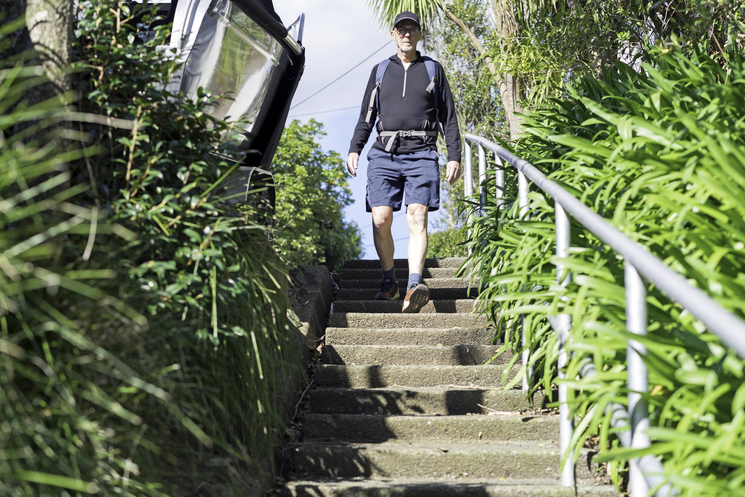 Senior male walks to the local supermarket to do the weekly grocery shopping | Source: Getty Images