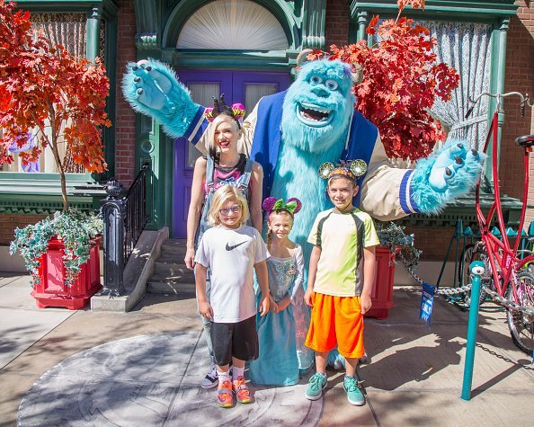 Gwen Stefani and her sons, Kingston Rossdale (right) and Zuma Rossdale, and niece, Stella, meet Sulley from the Disney-Pixar films 'Monsters, Inc.' and 'Monsters University' at Disney California Adventure park October 6, 2014, in Anaheim, California. | Source: Getty Images.