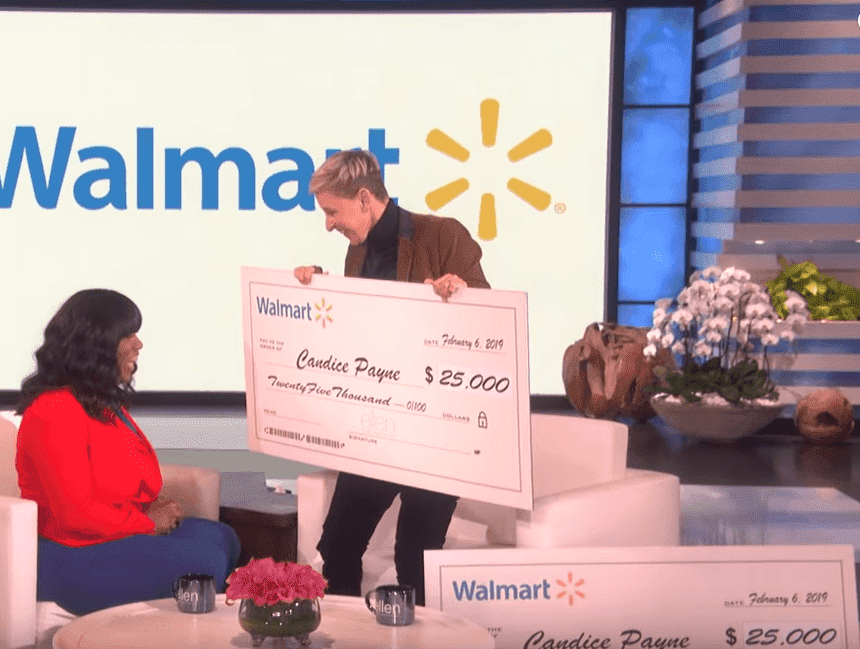 Screenshot of DeGeneres presenting Payne with her cash gifts. | Photo: YouTube/TheEllenShow