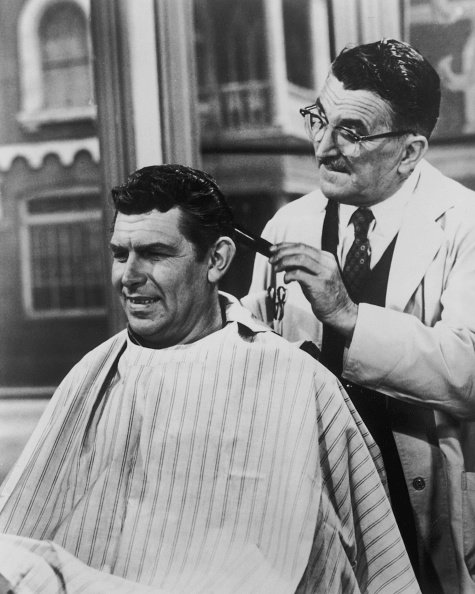 Andy Griffith as Sheriff Andy Taylor and Howard McNear as barber Floyd Lawson in a scene from the television series "The Andy Griffith Show," circa 1965. | Photo: Getty Images