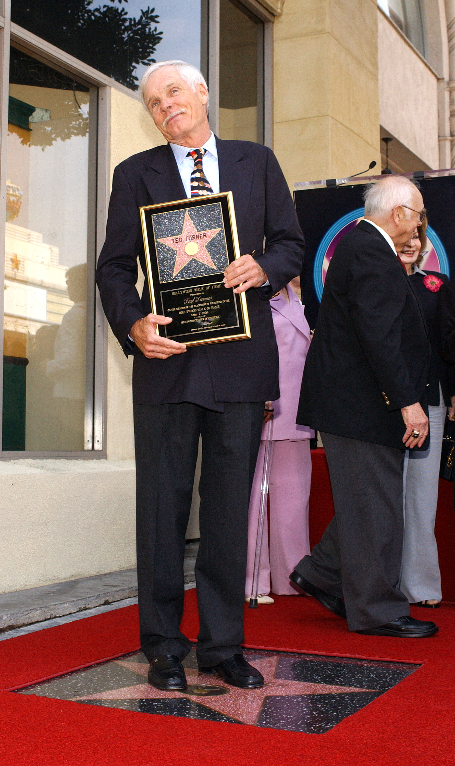 Ted Turner attends a ceremony honoring him with a star on the Hollywood Walk of Fame April 7, 2004 in Hollywood, California | Source: Getty Images