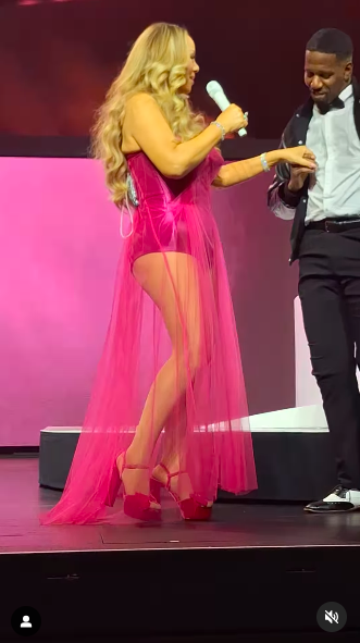 Mariah Carey performing on stage with Asiel Hardison during her concert, posted on February 7, 2025. | Source: Instagram/gsxr_freak02