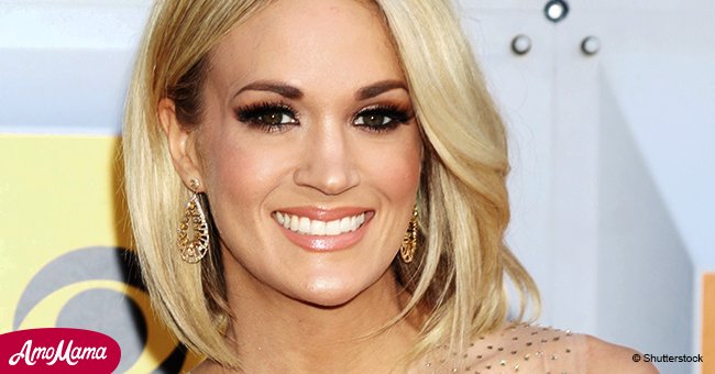 Carrie Underwood shows off the scar caused by her fall that runs from her lip to her nose