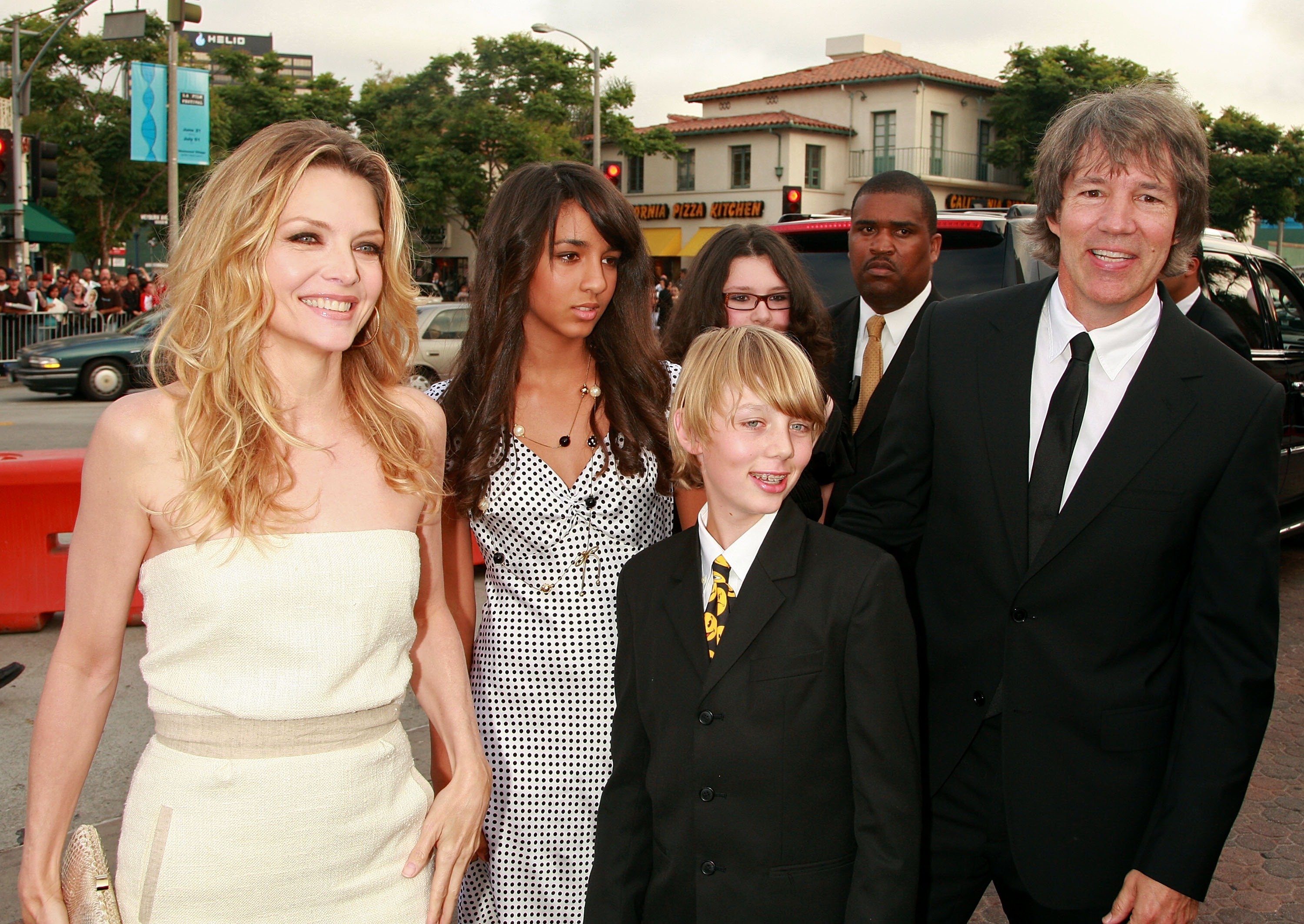 Michelle Pfeiffer, daughter Claudia, son John Henry, and husband David E. Kelley arrive to the Los Angeles premiere of New Line Cinema's "Hairspray" on July 10, 2007, in Westwood, California | Source: Getty Images