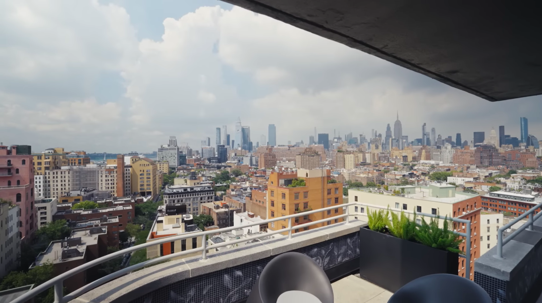 The terrace opens onto an extraordinary sweep of New York, with older neighborhood rooftops meeting the city's taller towers beyond. It is exactly the kind of view Christopher and Sherman were determined not to lose again. | Source: YouTube/Architectural Digest