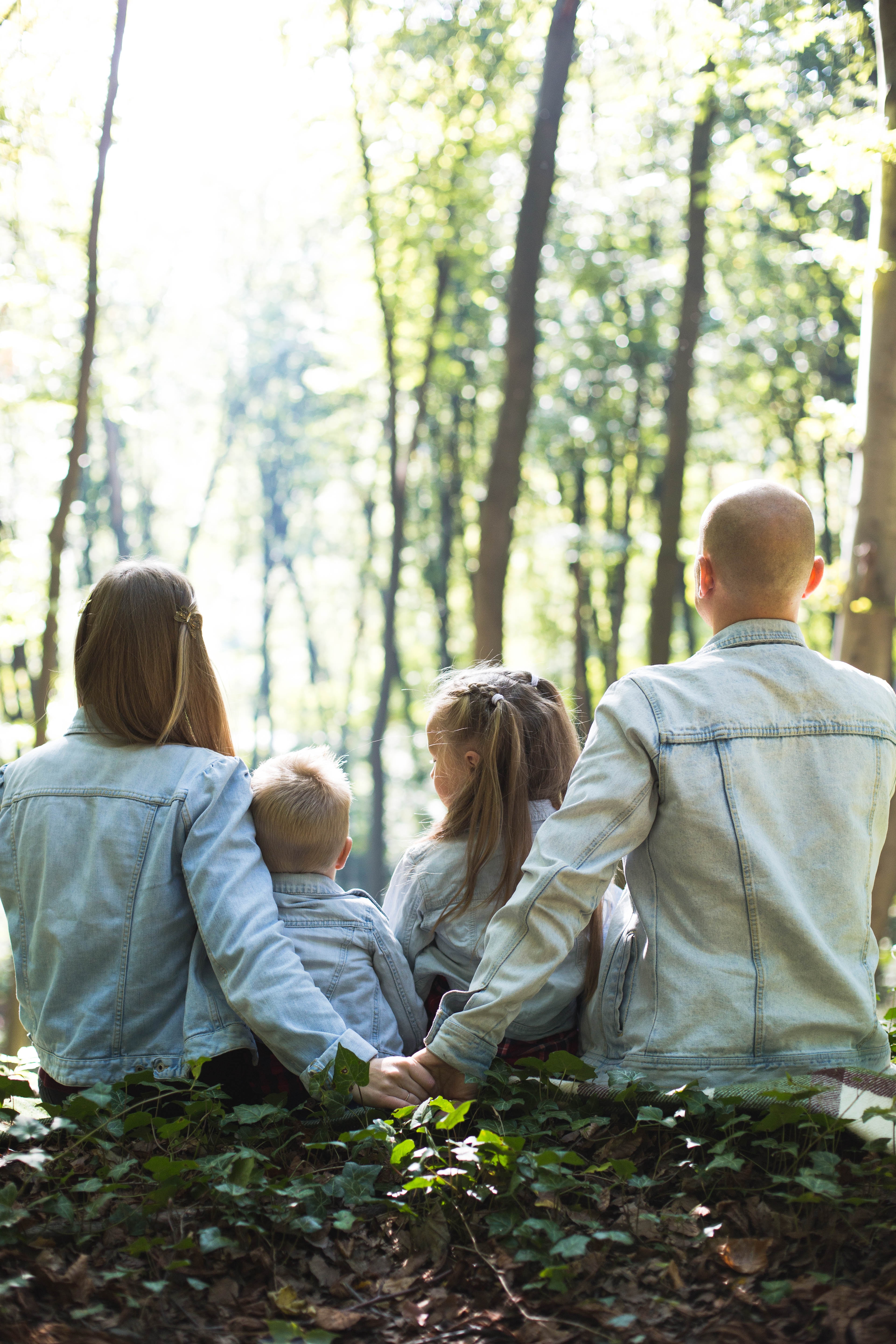 A family sitting in nature together. | Source: Unsplash