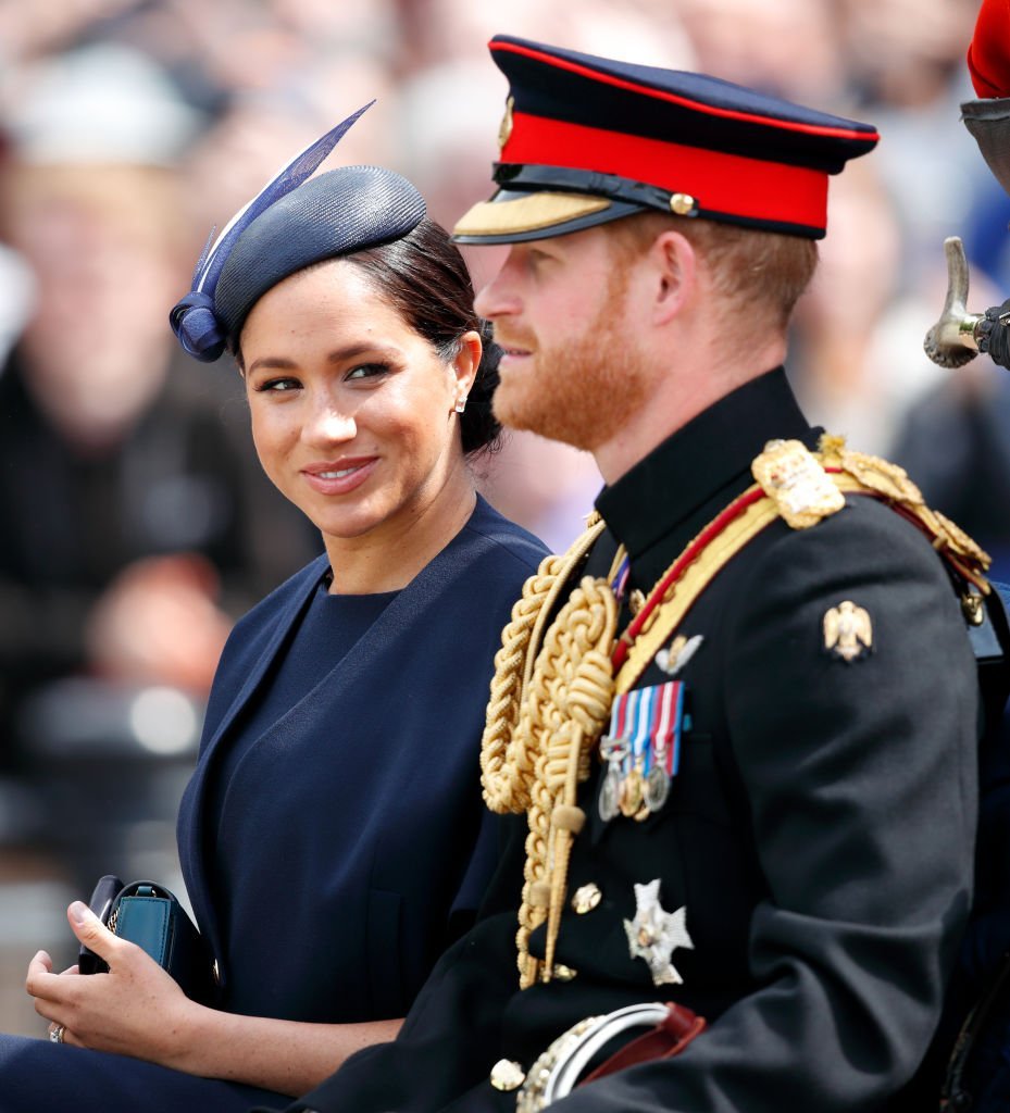 Meghan and Prince Harry travel down The Mall in a horse drawn carriage during Trooping The Colour | Photo: Getty Images