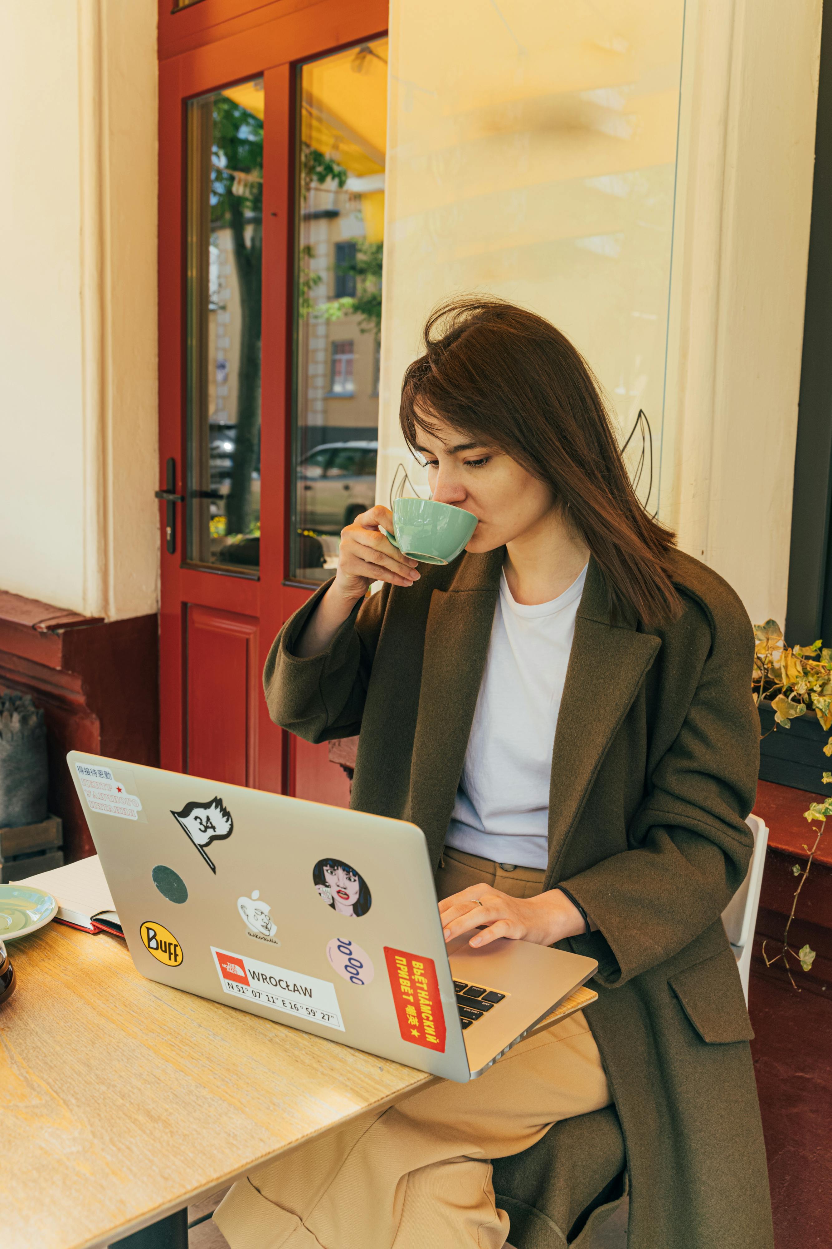 A woman sipping coffee | Source: Pexels