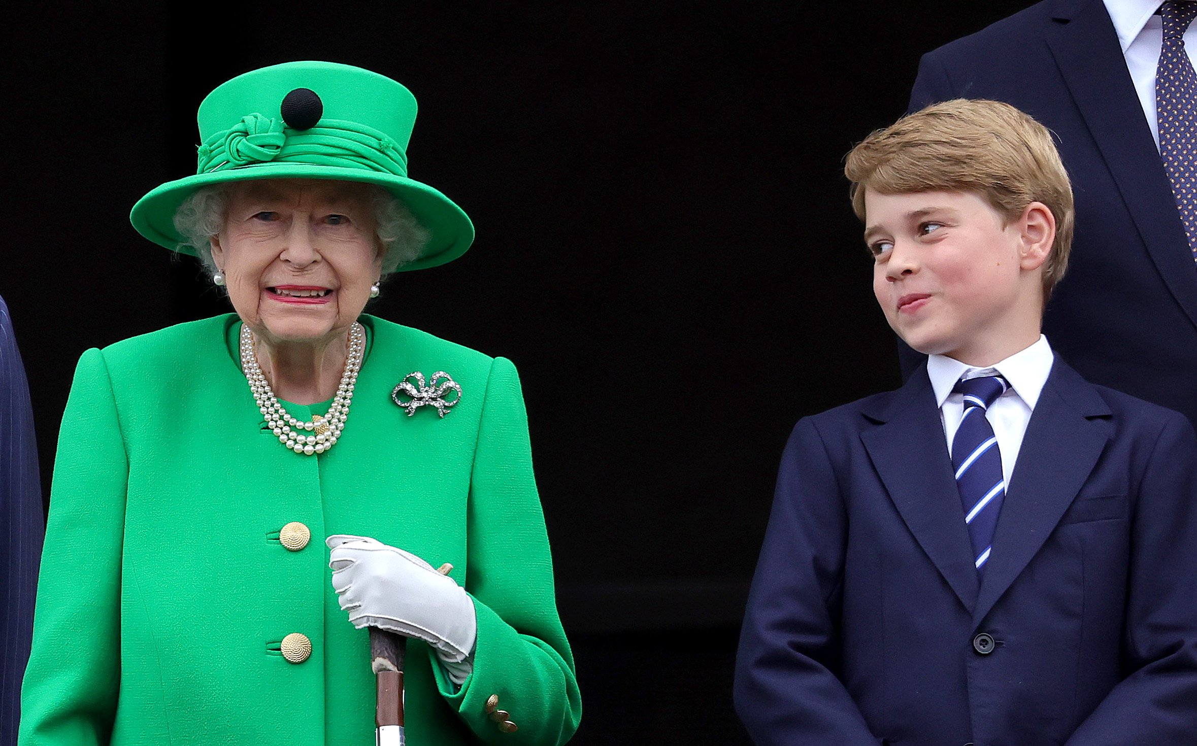Queen Elizabeth II and Prince George of Cambridge on the balcony of Buckingham Palace during the Platinum Jubilee Pageant on June 05, 2022 in London, England | Source: Getty Images