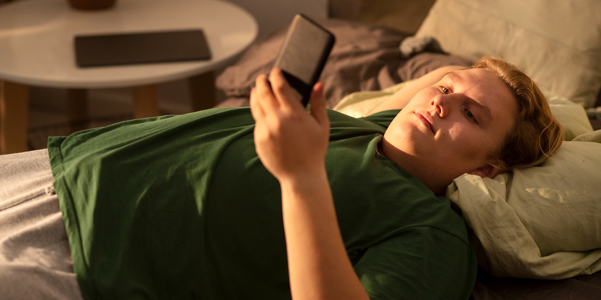 Teenager in his bed | Source: Freepik