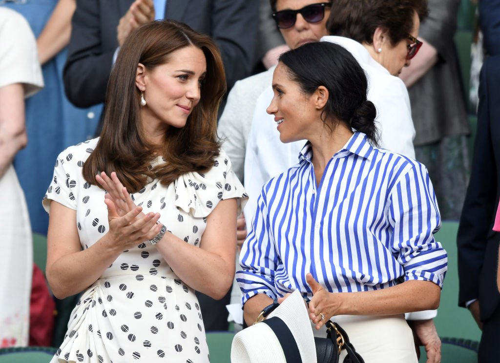Catherine, Duchess of Cambridge and Meghan, Duchess of Sussex attend day twelve of the Wimbledon Tennis Championships at the All England Lawn Tennis and Croquet Club on July 14, 2018. | Photo: Getty Images