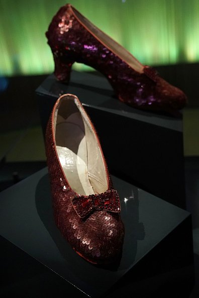 The "ruby slippers" which Judy Garland wore during the 1939 filming of 'The Wizard of Oz' are put on display | Photo: Getty Imagez