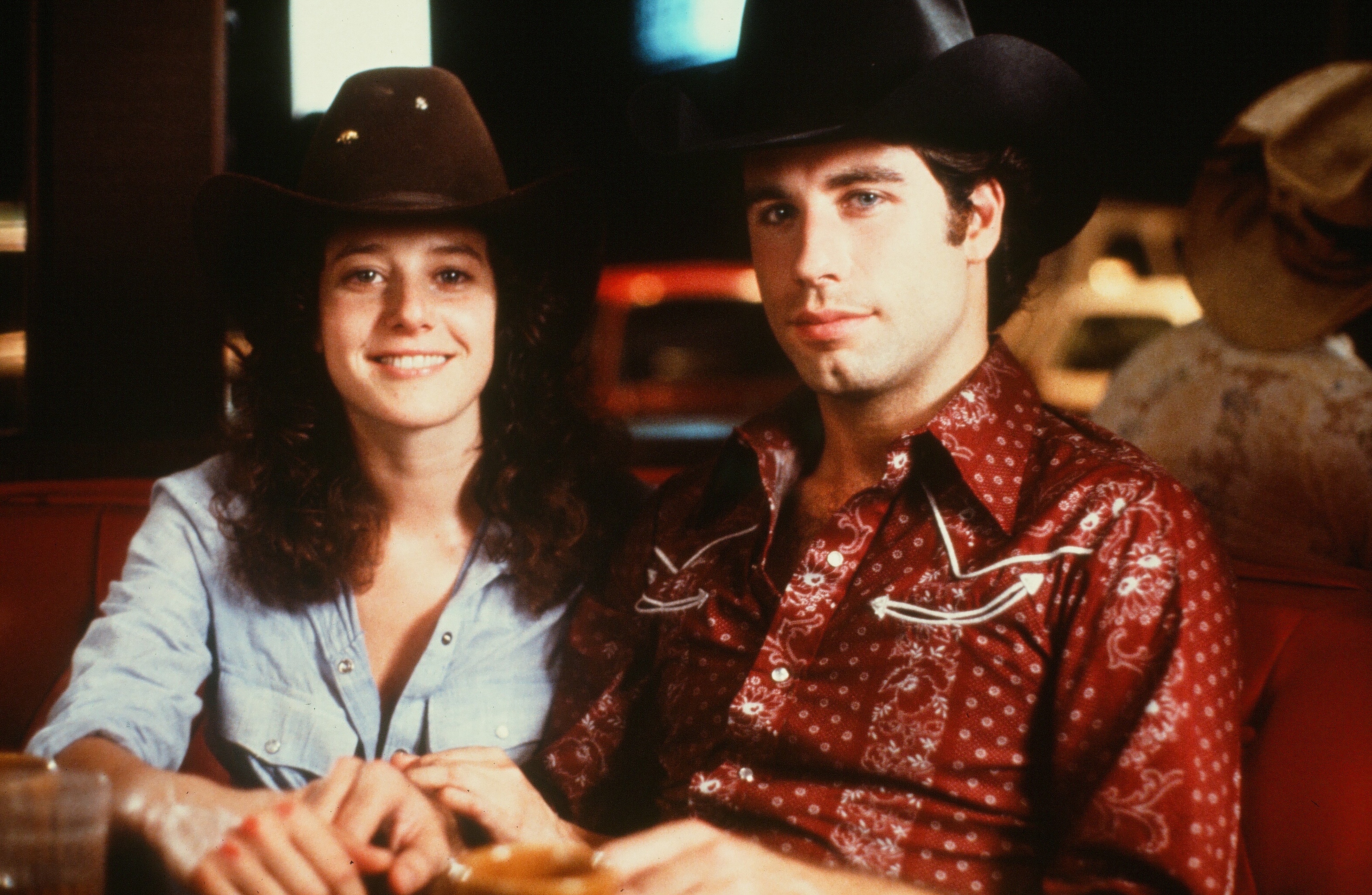 Debra Winger and John Travolta on the set of "Urban Cowboy," in 1980. | Source: Getty Images