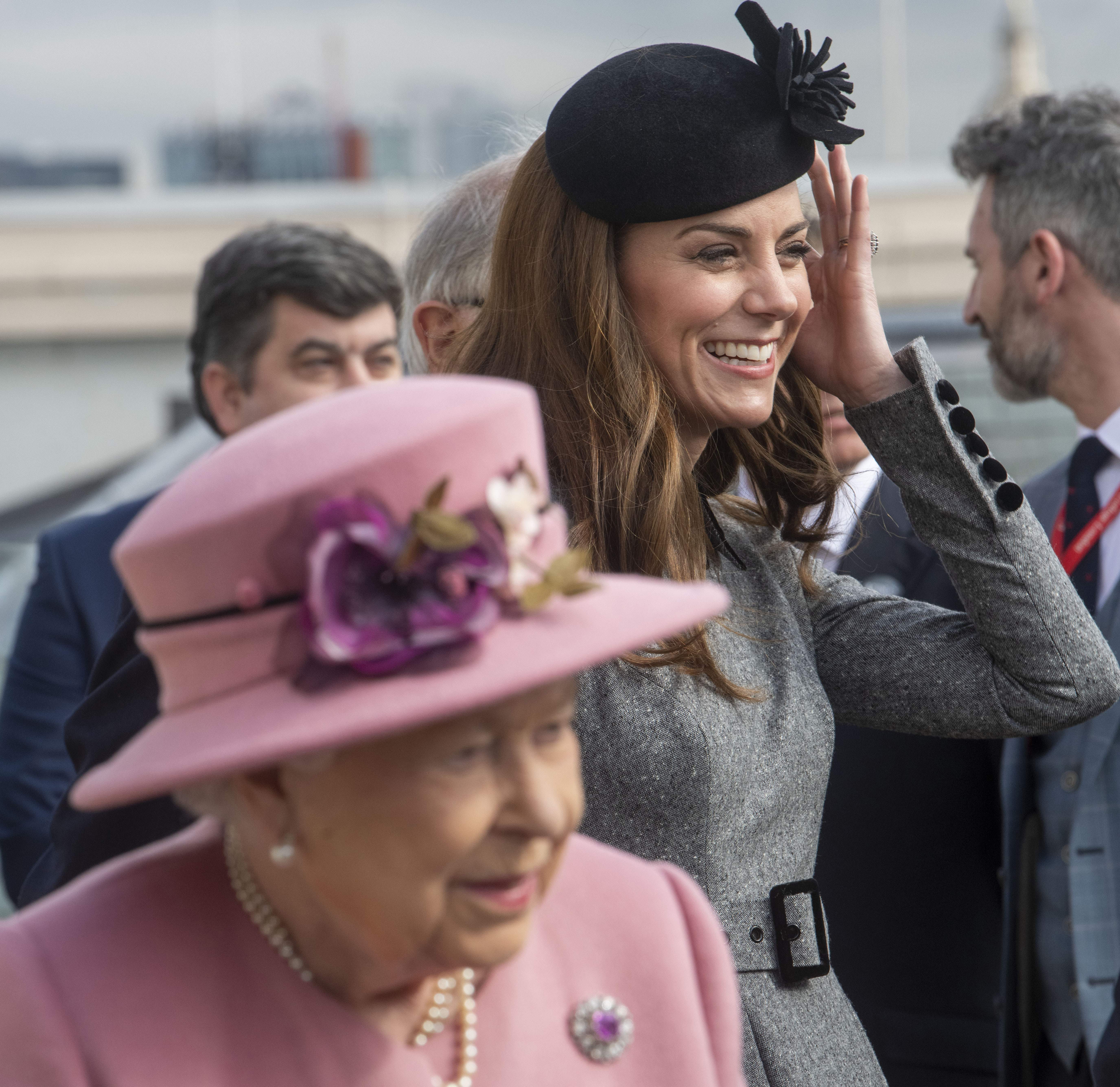 Queen Elizabeth II and Duchess Kate visit Kings College to open Bush House in central London on March 19, 2019 | Source: Getty Images
