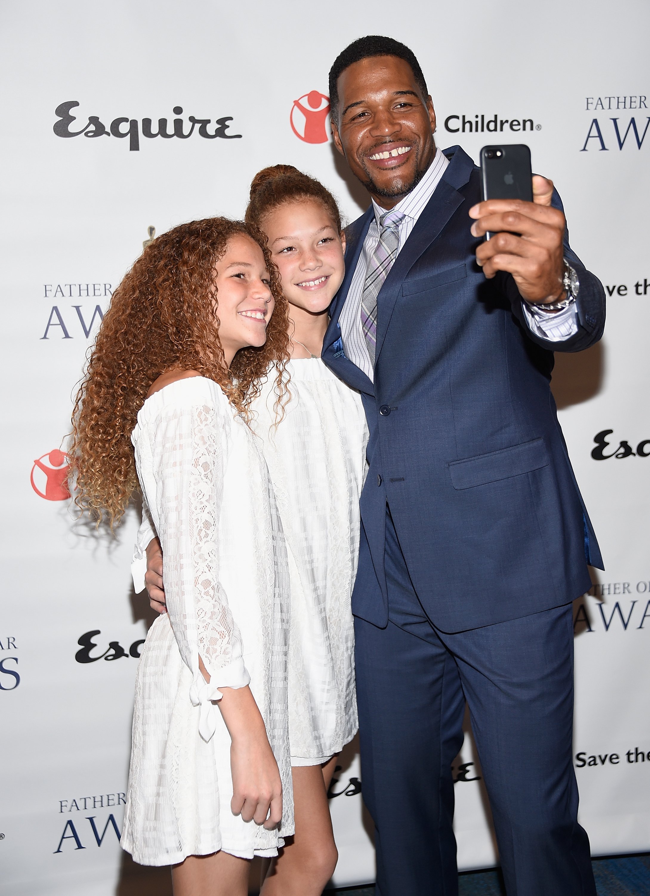 Michael Strahan with daughters Isabella Strahan and Sophia Strahan attend The 76th Annual Father Of The Year Awards at New York Hilton on June 15, 2017 in New York City. | Source: Getty Images 
