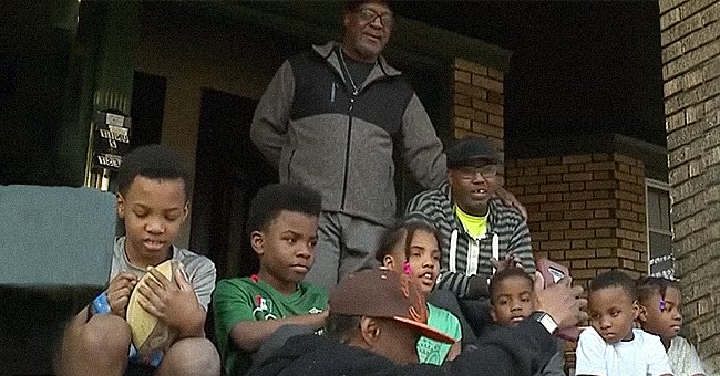 James Harris with his children and Pastor Wayne Glenn sitting outside. | Source: youtube.com/News 5 Cleveland