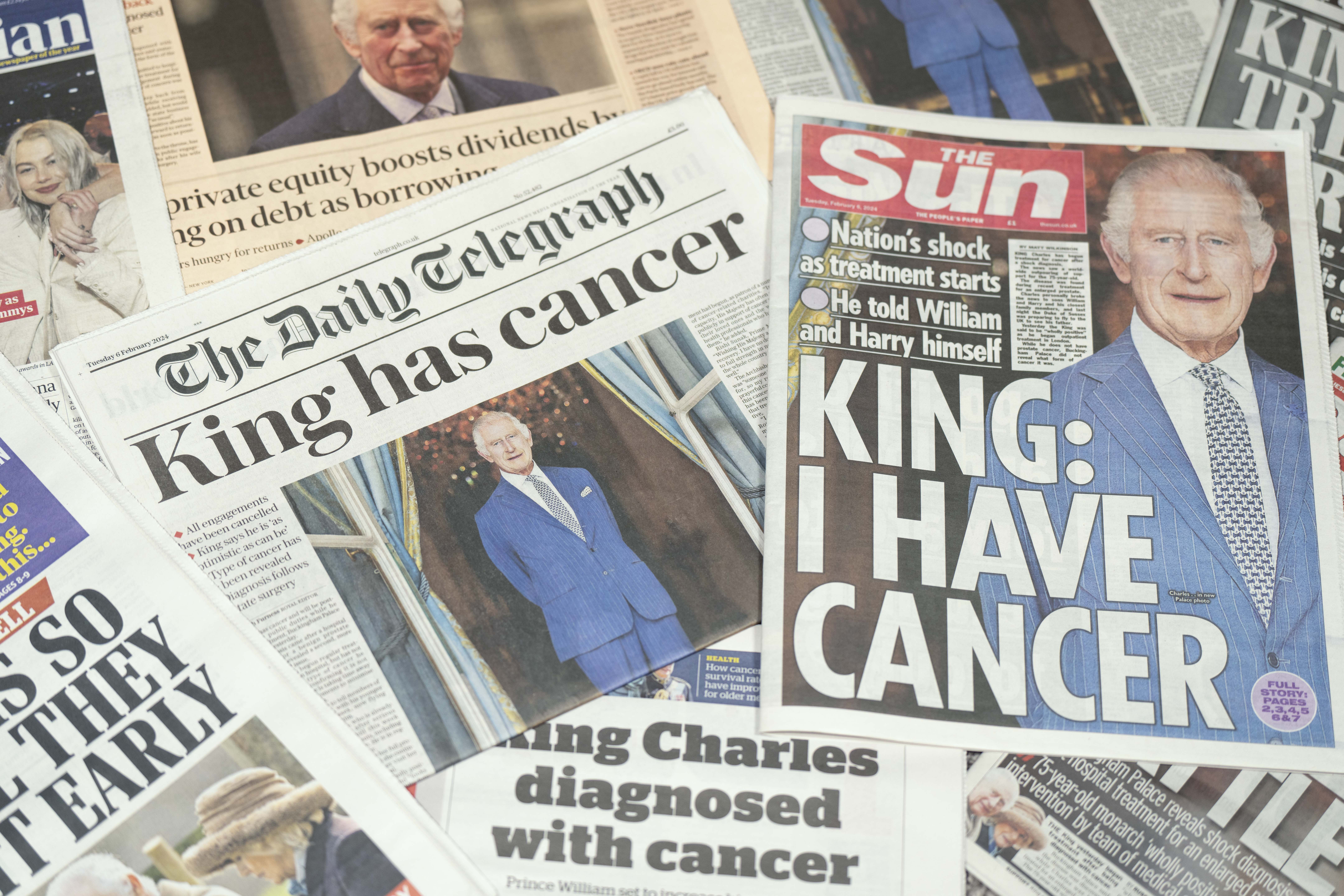 A selection of newspapers headlining King Charles III's cancer announcement | Source: Getty Images