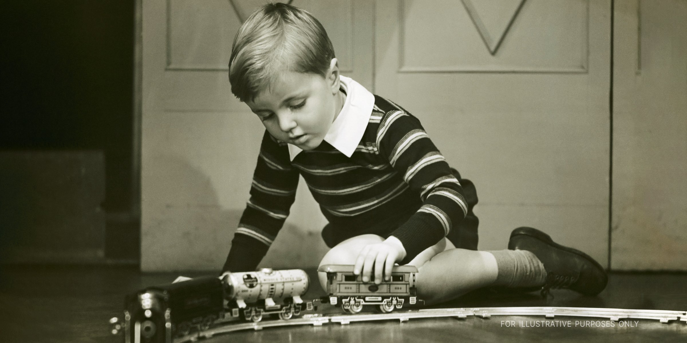Little boy playing with a toy train | Source: Getty Images