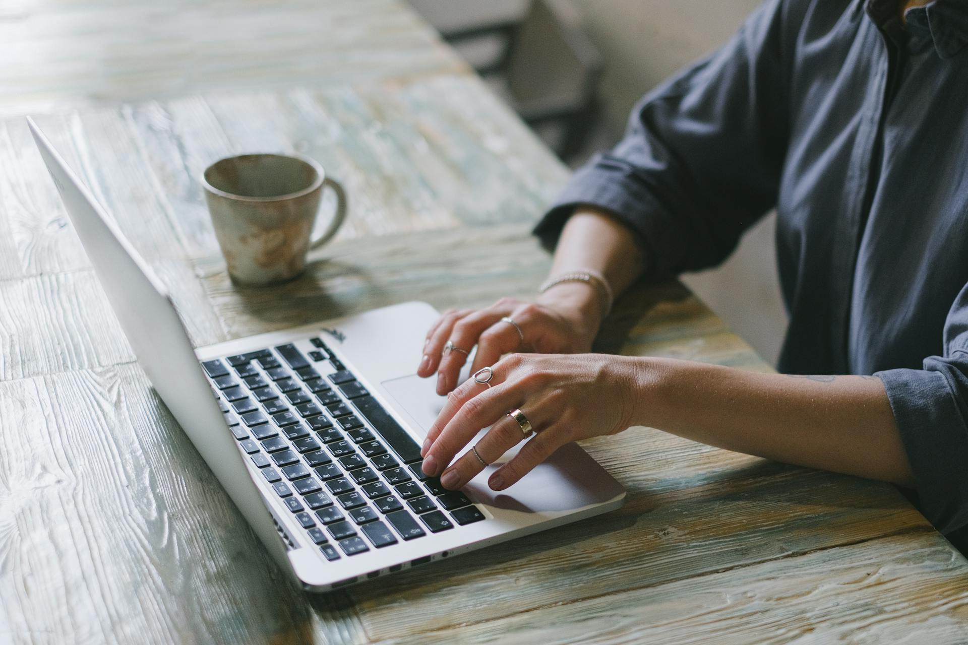 A closeup shot of a woman working on her laptop | Source: Pexels